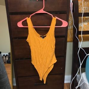 yellow body suit.
